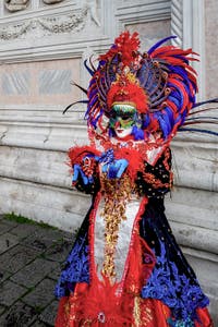 The parade of people in costume at the 2026 Venice Carnival in front of the Church of San Zaccaria.