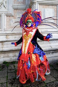 The parade of people in costume at the 2026 Venice Carnival in front of the Church of San Zaccaria.