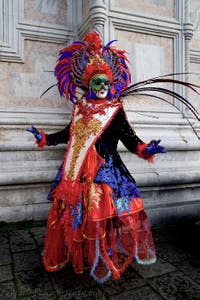 The parade of people in costume at the 2026 Venice Carnival in front of the Church of San Zaccaria.