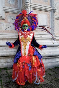 The parade of people in costume at the 2026 Venice Carnival in front of the Church of San Zaccaria.