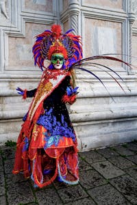 The parade of people in costume at the 2026 Venice Carnival in front of the Church of San Zaccaria.