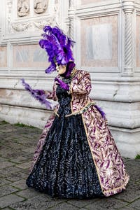 The parade of people in costume at the 2026 Venice Carnival in front of the Church of San Zaccaria.