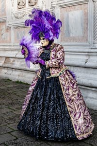 The parade of people in costume at the 2026 Venice Carnival in front of the Church of San Zaccaria.