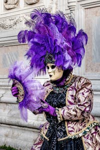 The parade of people in costume at the 2026 Venice Carnival in front of the Church of San Zaccaria.