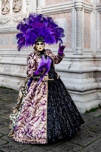 The parade of people in costume at the 2026 Venice Carnival in front of the Church of San Zaccaria.