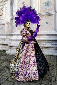 The parade of people in costume at the 2026 Venice Carnival in front of the Church of San Zaccaria.