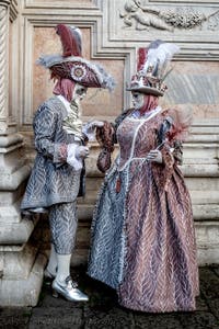 The parade of people in costume at the 2026 Venice Carnival in front of the Church of San Zaccaria.