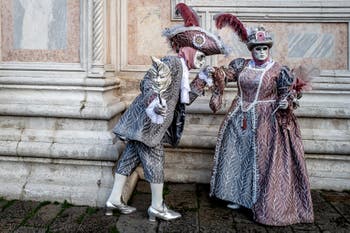 The parade of people in costume at the 2026 Venice Carnival in front of the Church of San Zaccaria.
