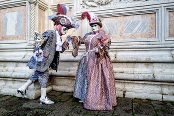 The parade of people in costume at the 2026 Venice Carnival in front of the Church of San Zaccaria.