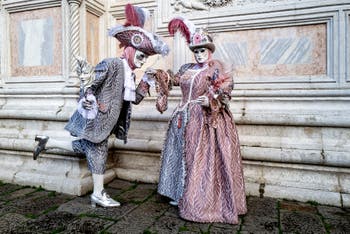 Venice carnival costumed figures