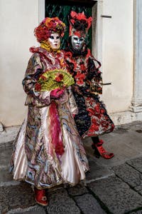 The parade of people in costume at the 2026 Venice Carnival in front of the Church of San Zaccaria.