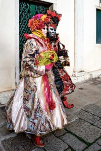 The parade of people in costume at the 2026 Venice Carnival in front of the Church of San Zaccaria.