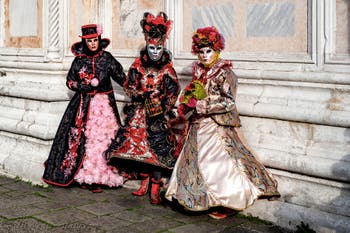 The parade of people in costume at the 2026 Venice Carnival in front of the Church of San Zaccaria.