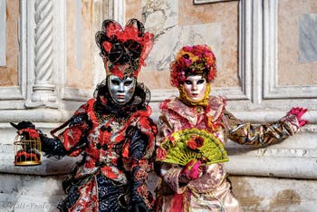 The parade of people in costume at the 2026 Venice Carnival in front of the Church of San Zaccaria.