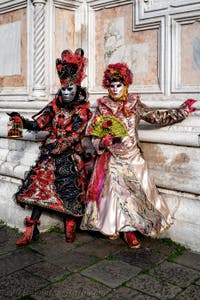 The parade of people in costume at the 2026 Venice Carnival in front of the Church of San Zaccaria.
