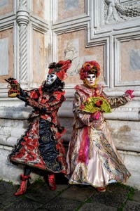 The parade of people in costume at the 2026 Venice Carnival in front of the Church of San Zaccaria.