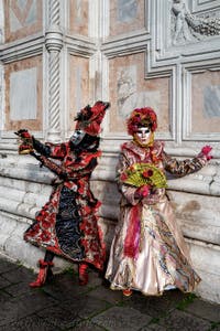 The parade of people in costume at the 2026 Venice Carnival in front of the Church of San Zaccaria.