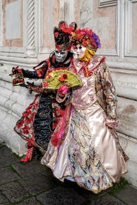 The parade of people in costume at the 2026 Venice Carnival in front of the Church of San Zaccaria.