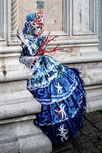 The parade of people in costume at the 2026 Venice Carnival in front of the Church of San Zaccaria.