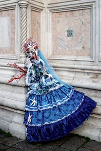 The parade of people in costume at the 2026 Venice Carnival in front of the Church of San Zaccaria.