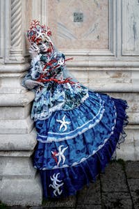 The parade of people in costume at the 2026 Venice Carnival in front of the Church of San Zaccaria.