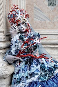 The parade of people in costume at the 2026 Venice Carnival in front of the Church of San Zaccaria.