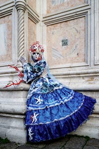 The parade of people in costume at the 2026 Venice Carnival in front of the Church of San Zaccaria.