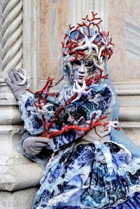 The parade of people in costume at the 2026 Venice Carnival in front of the Church of San Zaccaria.