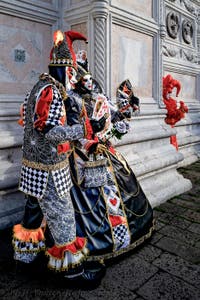 The parade of people in costume at the 2026 Venice Carnival in front of the Church of San Zaccaria.