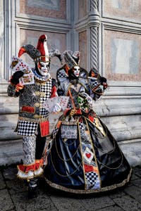 The parade of people in costume at the 2026 Venice Carnival in front of the Church of San Zaccaria.