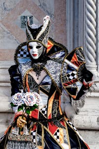 The parade of people in costume at the 2026 Venice Carnival in front of the Church of San Zaccaria.