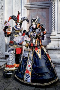 The parade of people in costume at the 2026 Venice Carnival in front of the Church of San Zaccaria.