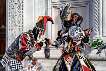 Venice carnival costumed figures