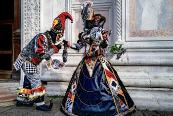 The parade of people in costume at the 2026 Venice Carnival in front of the Church of San Zaccaria.