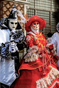 The parade of people in costume at the 2026 Venice Carnival in front of the Church of San Zaccaria.