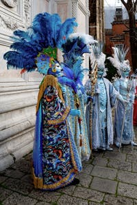 The parade of people in costume at the 2026 Venice Carnival in front of the Church of San Zaccaria.