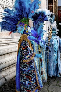 The parade of people in costume at the 2026 Venice Carnival in front of the Church of San Zaccaria.