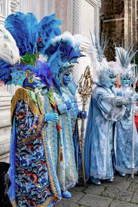 The parade of people in costume at the 2026 Venice Carnival in front of the Church of San Zaccaria.