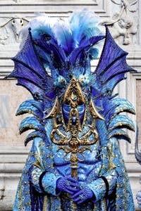 The parade of people in costume at the 2026 Venice Carnival in front of the Church of San Zaccaria.