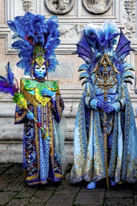 The parade of people in costume at the 2026 Venice Carnival in front of the Church of San Zaccaria.
