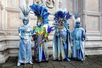 The parade of people in costume at the 2026 Venice Carnival in front of the Church of San Zaccaria.
