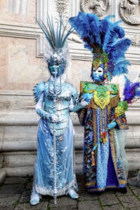 The parade of people in costume at the 2026 Venice Carnival in front of the Church of San Zaccaria.