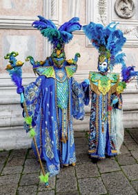 The parade of people in costume at the 2026 Venice Carnival in front of the Church of San Zaccaria.