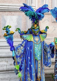 The parade of people in costume at the 2026 Venice Carnival in front of the Church of San Zaccaria.