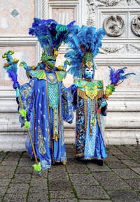 The parade of people in costume at the 2026 Venice Carnival in front of the Church of San Zaccaria.