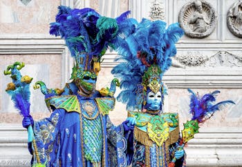 The parade of people in costume at the 2026 Venice Carnival in front of the Church of San Zaccaria.
