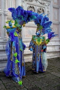 The parade of people in costume at the 2026 Venice Carnival in front of the Church of San Zaccaria.