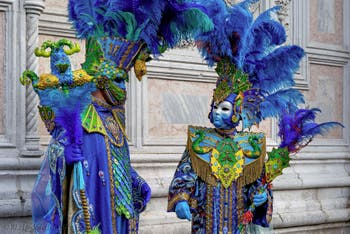 The parade of people in costume at the 2026 Venice Carnival in front of the Church of San Zaccaria.