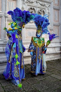 The parade of people in costume at the 2026 Venice Carnival in front of the Church of San Zaccaria.
