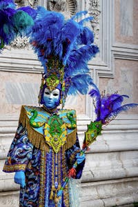 The parade of people in costume at the 2026 Venice Carnival in front of the Church of San Zaccaria.